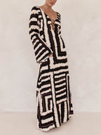 Flattering V-Neck Maxi Dress with Unique Printed Pattern and Ring-Tie Detail