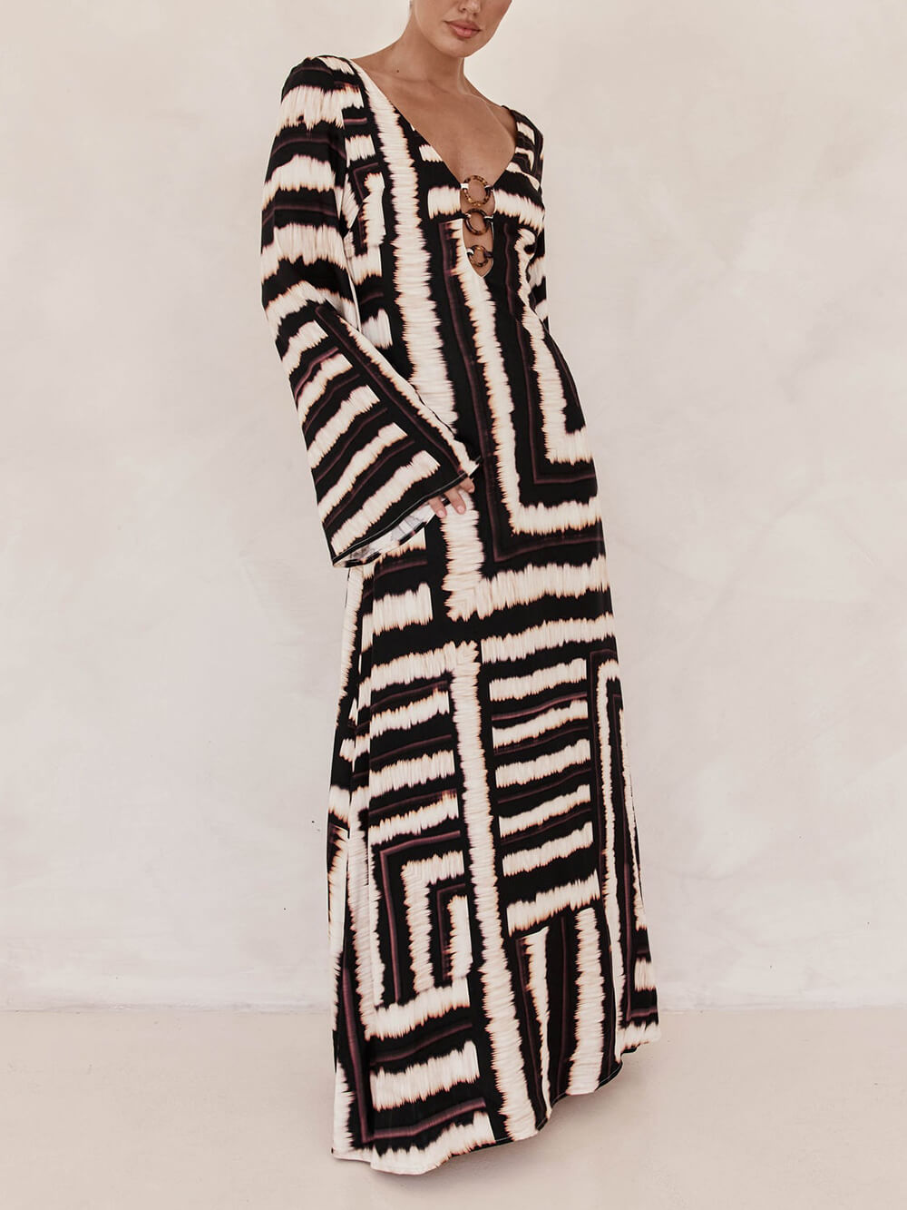 Flattering V-Neck Maxi Dress with Unique Printed Pattern and Ring-Tie Detail