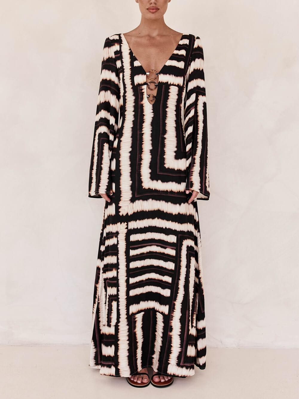Flattering V-Neck Maxi Dress with Unique Printed Pattern and Ring-Tie Detail