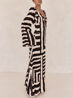 Flattering V-Neck Maxi Dress with Unique Printed Pattern and Ring-Tie Detail
