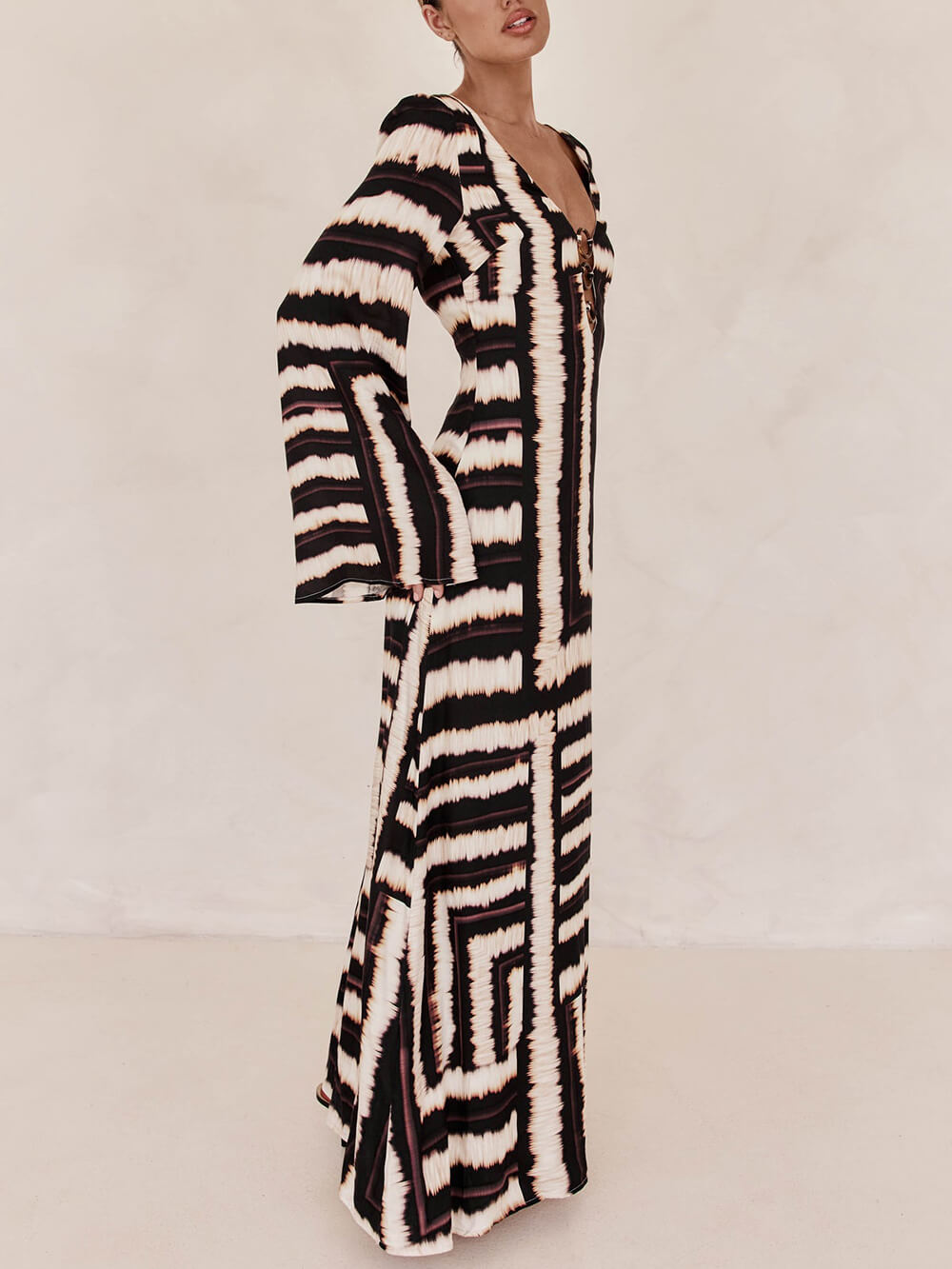 Flattering V-Neck Maxi Dress with Unique Printed Pattern and Ring-Tie Detail