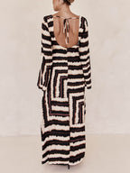 Flattering V-Neck Maxi Dress with Unique Printed Pattern and Ring-Tie Detail